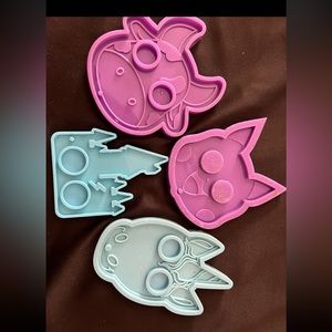 Set of 4! 
•1 Pikachu
•1 cow 
•1 unicorn 
•1 Harry Potter house ￼
Lightly used